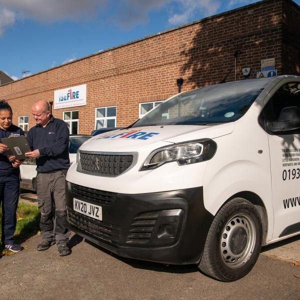 The Fire Alarm Systems team signing a document