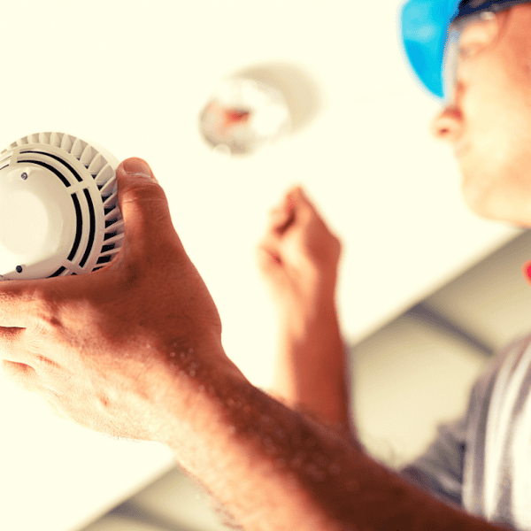 A fire alarm being installed