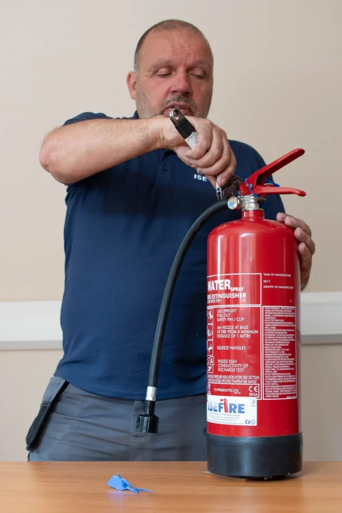 Do I Really Need a Fire Safety Risk Assessment? 1 An engineer servicing a fire extinguisher