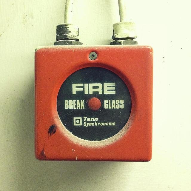 A fire alarm sounder on a wall