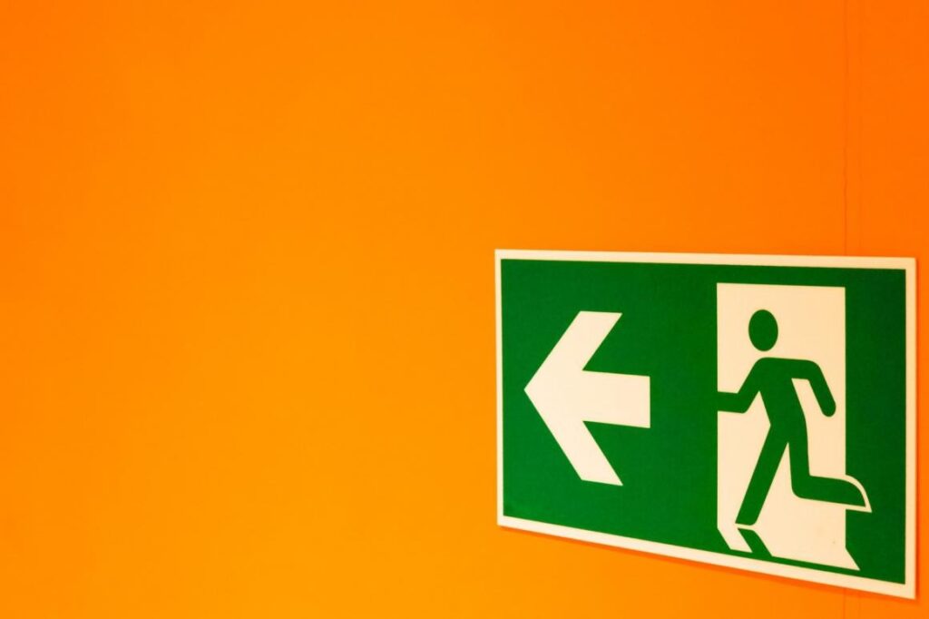 Do I Really Need a Fire Safety Risk Assessment? 2 A fire exit sign on an orange background