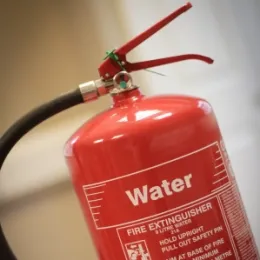 A red water fire extinguisher, suitable for Class A fires