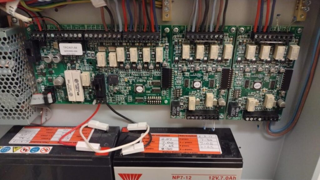 An open fire alarm control panel after rewiring