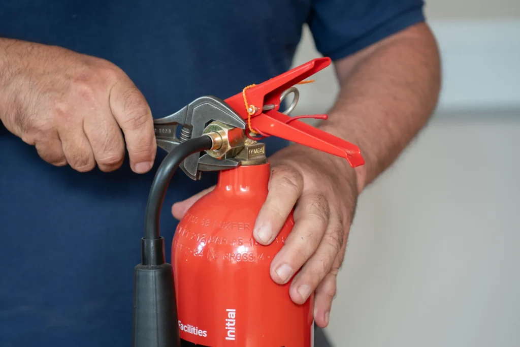 A fire extinguisher being serviced