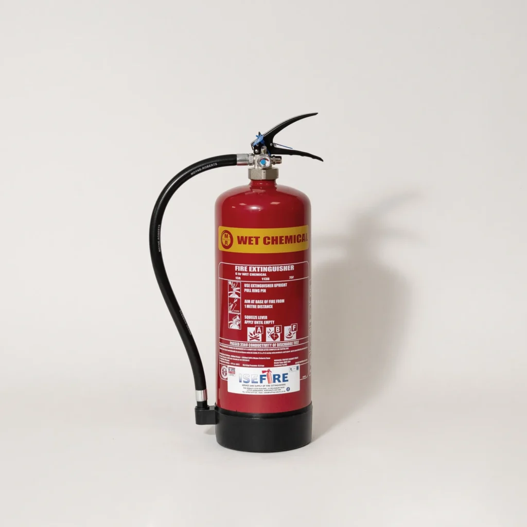 A yellow wet chemical fire extinguisher, suitable for Class F kitchen fires